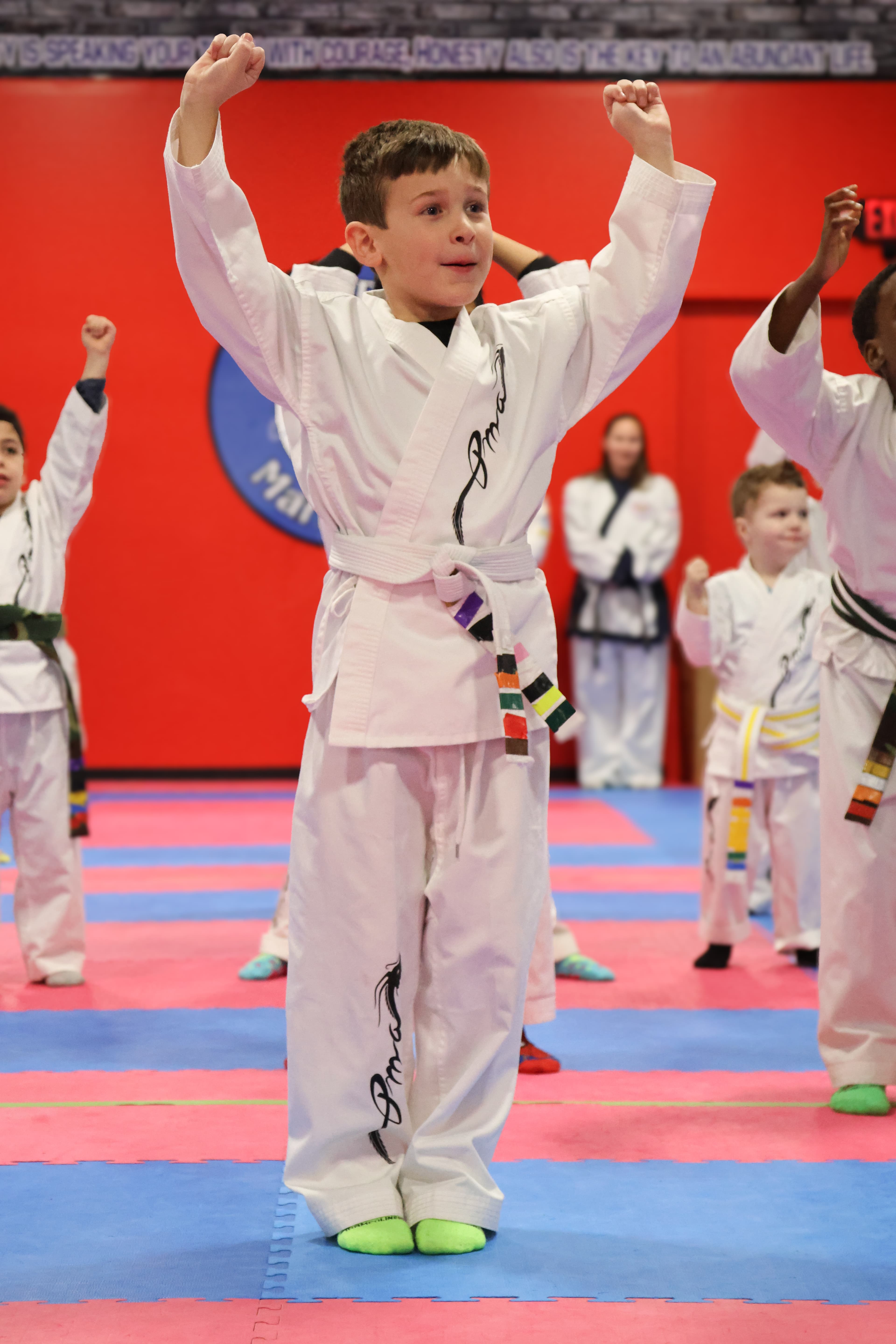 Little Dragon student in a celebration pose